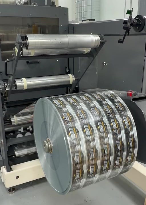 Printed product-label web running through Lone Star finishing equipment